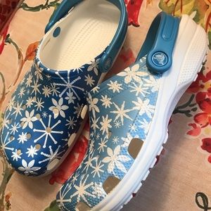 Blue Crocs with white flowers